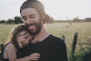 Man with daughter hugging