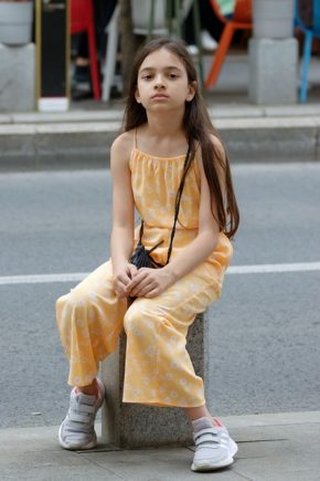 Young girl sitting down