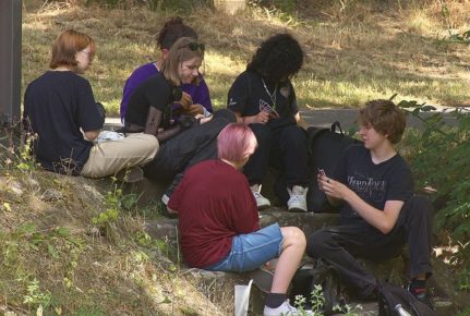 Students sitting playing Uno