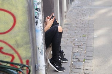 girl hiding doing drugs at school