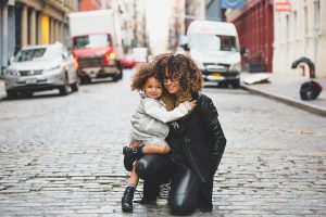 Mom hugging her daughter