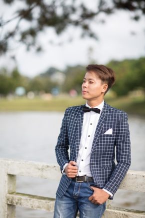 Asian male teen in blazer and bowtie