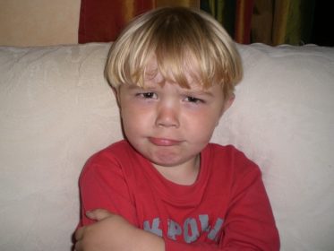 Young child with upset expression