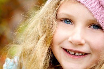 Young blonde girl smiling