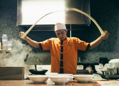 Asian chef with noodles