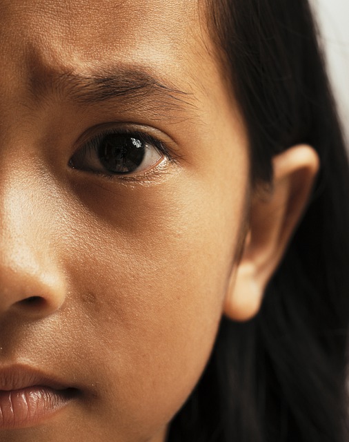 Half of a Hispanic girl's face up close