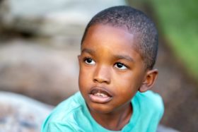 Young black male student looking sad