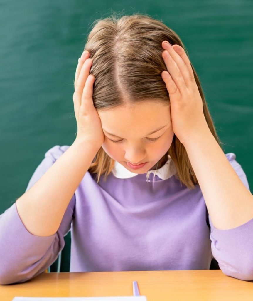 Young female student head in hands