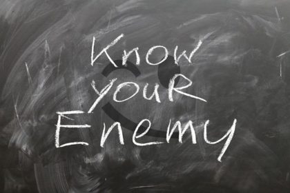Chalkboard with words "Know your enemy"