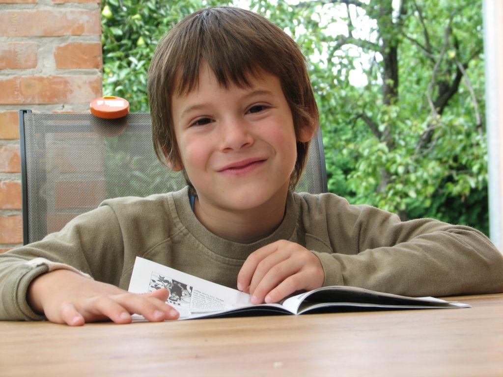 Young special needs boy with book