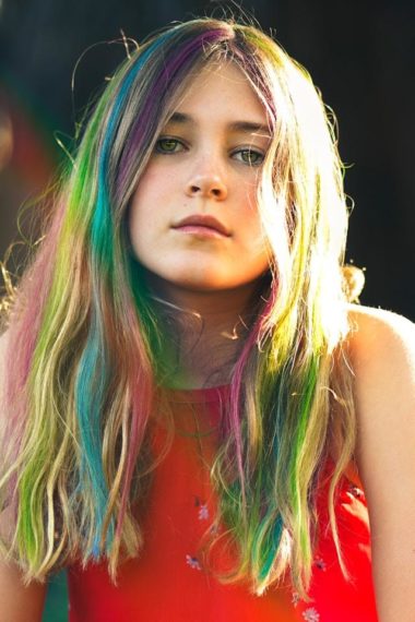 Teen with rainbow hair and red shirt
