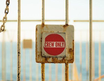 Picture of gate with "Crew Only" sign