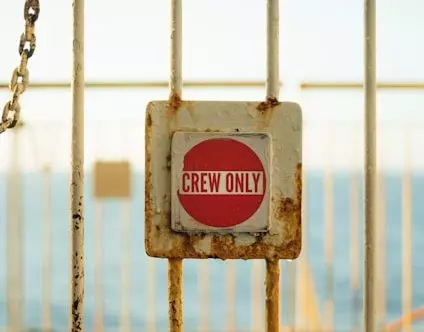 Picture of gate with "Crew Only" sign