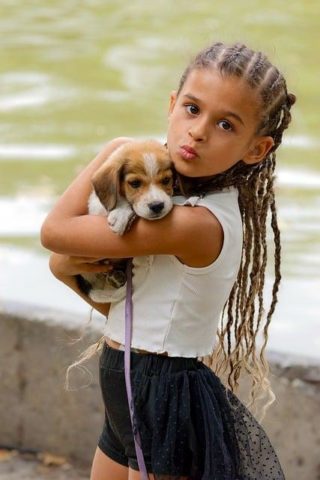 Girl holding puppy