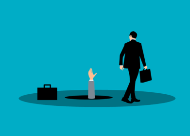 Hand coming out of hole in ground to businessman ignoring it with briefcase