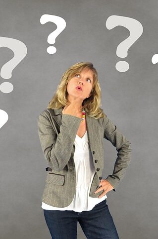 Female parent looking up at question marks, finger on chin
