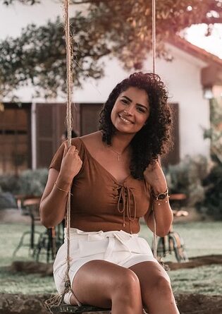 Woman smiling on swing